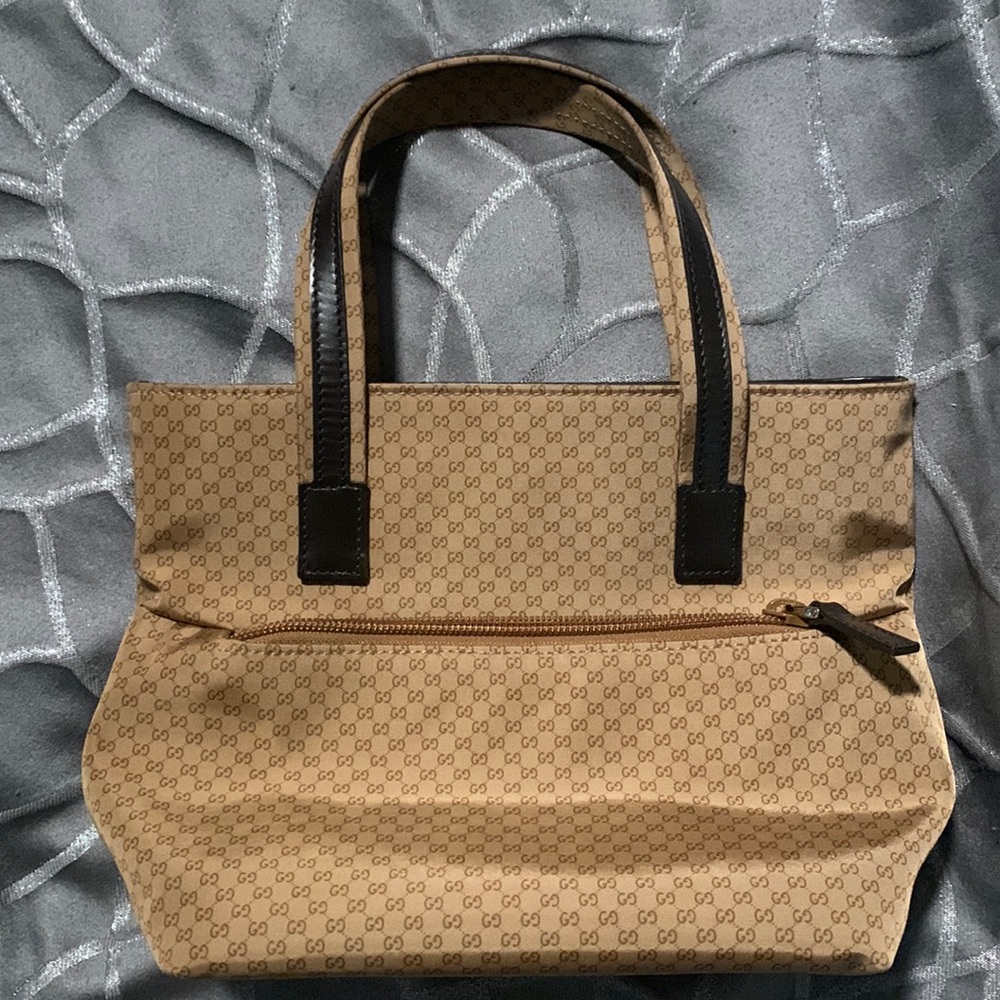 Authentic Brown canvas Gucci guccissima small bag.